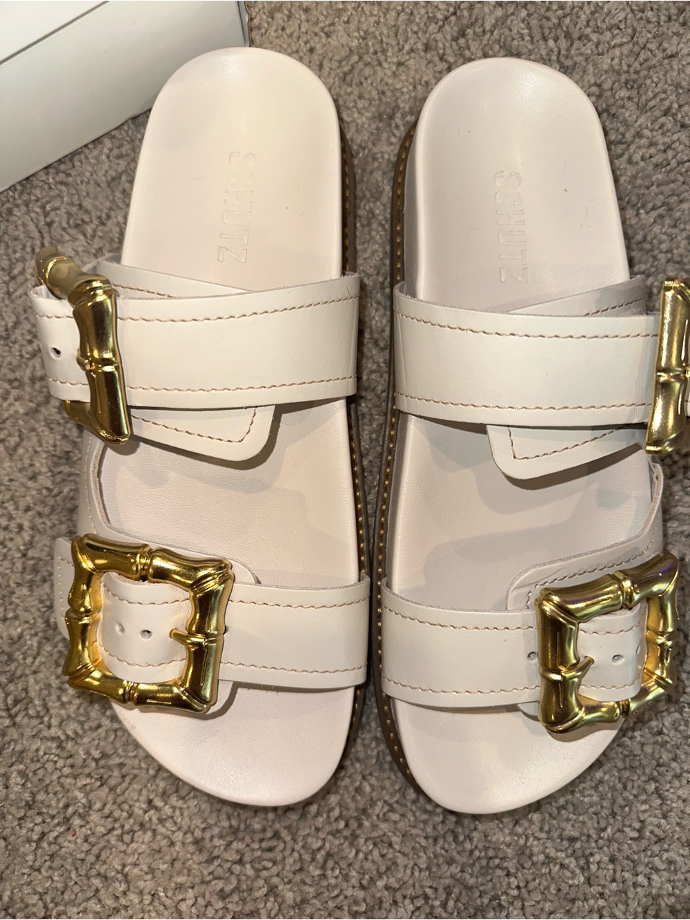 SCHUTZ Cream Slide Sandals with Gold Buckles